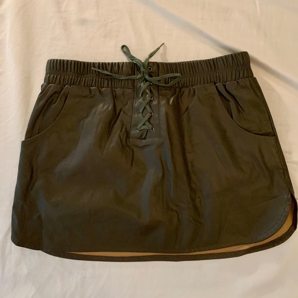 Green leather skirt with tie top.